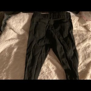 Black jeans, holes going all the way down